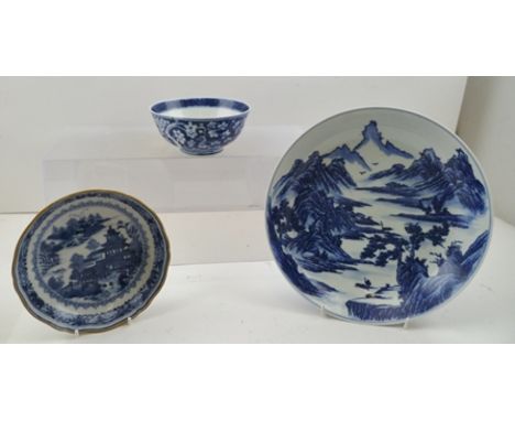 A CHINESE PORCELAIN SHALLOW BOWL, decorated in a cobalt blue mountain landscape, 23.5cm diameter, character seal mark to base