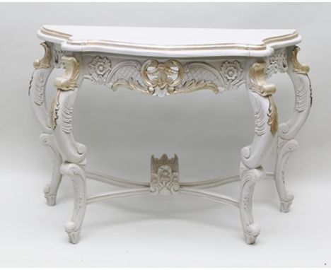 A CONTINENTAL PAINTED ON CARVED WOOD CONSOLE TABLE, in grey and gilt, raised on scroll supports, 108cm wide 