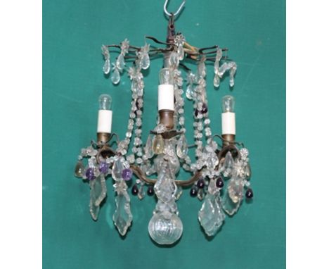 A LATE VICTORIAN GLASS CHANDELIER with crystal and purple droppers 