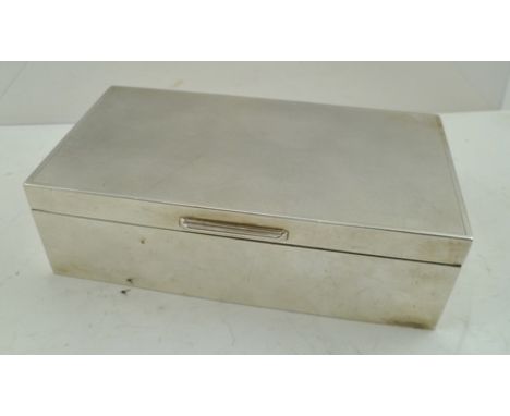 MANTON LTD. A RECTANGULAR SILVER CIGARETTE BOX having engine turned decorated lid, hinged, with cedar lined interior, un-engr