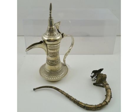 A MIDDLE EASTERN, POSSIBLY BEDOUIN COFFEE POT, with broad base, hinged cover with finial, 23.5cm high, together with a scroll