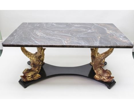 A FAUX MARBLE DINING TABLE, raised on four substantial gilded dolphin supports, 158cm x 91cm, together with the MATCHING PAIR