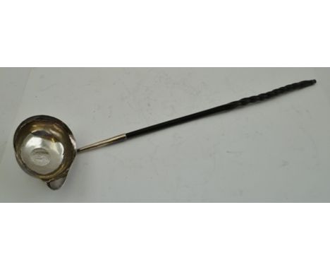 MAKER'S MARK RUBBED A GEORGE III SILVER PUNCH LADLE having plain oval bowl, inset with the king's shilling and whale bone twi