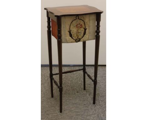 A Edwardian table work box, on tapered legs with bobbin turned stretchers, the shaped rectangular top with quartered veneer a