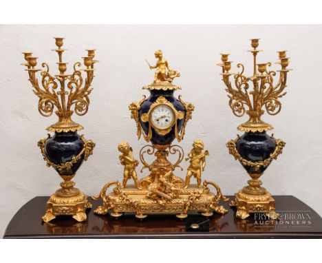 An impressive and large antique clock garniture c1870 by Demuer Du Roi, the ormolu and blue glazed porcelain clock designed a