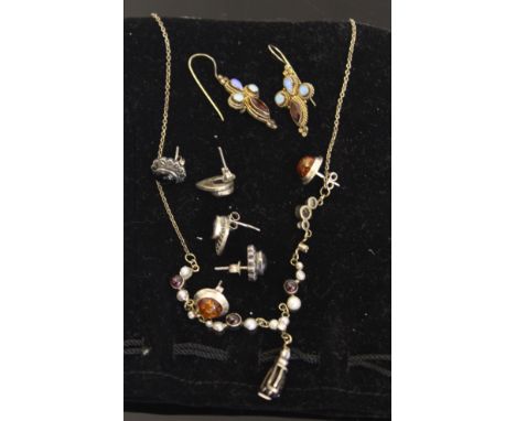 A silver garnet, pearl and diamond set necklace; a pair of Venetian style earrings stamped 925; and three pairs of silver ear