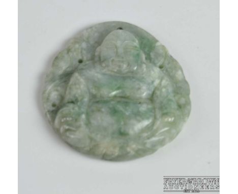 A Chinese jade pendant of a Buddha, c1920, 5cm max