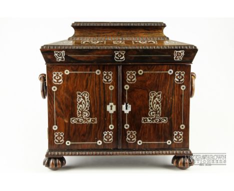 A good Regency rosewood inlaid with mother of pearl necessaire, c1825, the rosewood box with two doors opening to reveal thre