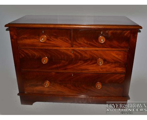 A Victorian flame mahogany small chest of drawers, c1860, the low chest with bevelled edge, mahogany top with two small drawe