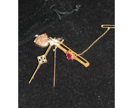 An antique rose-cut diamond and ruby stick pin; an Edwardian 15ct gold natural pearl and sapphire bar brooch; an 18ct gold an