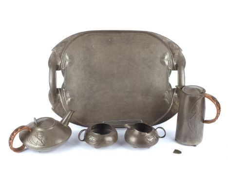 ARCHIBALD KNOX (1864-1933) FOR LIBERTY & CO, A Tudric pewter five piece tea service, no 0231, cast in low relief with vines, 