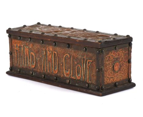 ARTS AND CRAFT, glove box, copper and wood,  decorated in repousse work, with winged griffon to the lid, Hand and Glove to th
