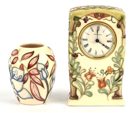SALLY TUFFIN (British, b. 1938)for MOORCROFT, pottery mantel clock tube line decorated in the flowering trellis design agains