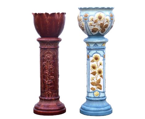 BURMANTOFTS, a pottery jardinière, moulded with floral panels, on blue ground, 95cm high, and a red glazed jardinière and sta