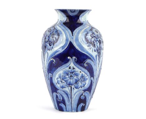 WILLIAM MOORCROFT (1872-1945) for MACINTYRE & CO, a large Blue on blue Florian vase, circa 1900 Glazed earthenware Underside 