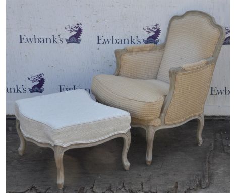 WYCHWOOD DESIGN, Armchair/Fauteuil, in the Louis XV style, together with an ottoman, chair upholstered in gold and grey/cream