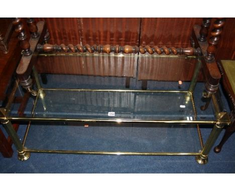 A BRASS FRAMED GLASS TOPPED COFFEE TABLE, with under shelf