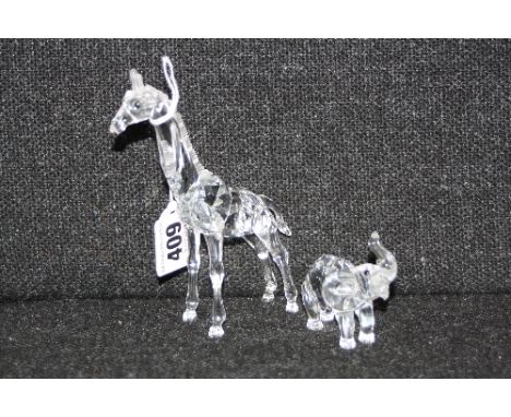 TWO SWAROVSKI ANIMALS, Giraffe, height approximately 13.5cm and Elephant, trunk raised, height approximately 6cm (2)