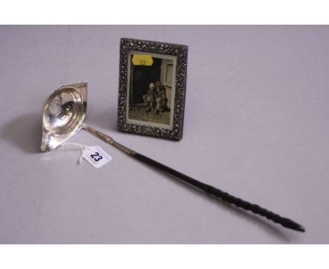 A SILVER TODDY LADLE, having coin base and turned handle, London 1792, together with a small silver rectangular easel picture