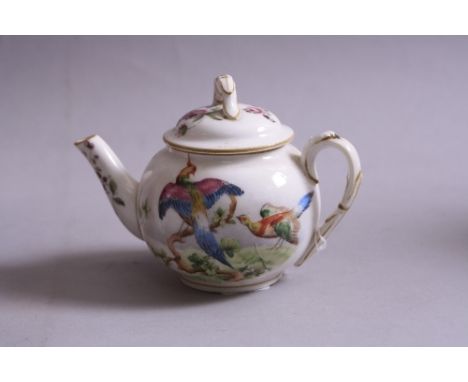 A SMALL ROYAL WORCESTER TEAPOT, decorated with birds of paradise, height approximately 10cm