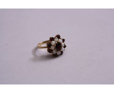 A LATE 20TH CENTURY OPAL AND GARNET CLUSTER RING, hallmarked 9ct gold, ring size G, gross weight 4.3 grams