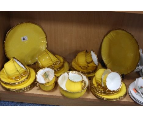 HAMMERSLEY TEAWARES, yellow with gilt trim, No.12915 (over 30 pieces) (some hairlines)