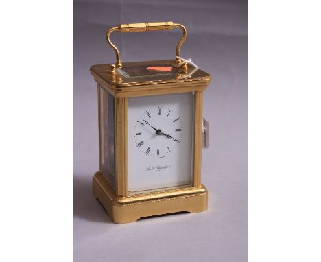 A BRASS CARRIAGE CLOCK, by Robert Blandford 1873, approximate height 14cm (key)