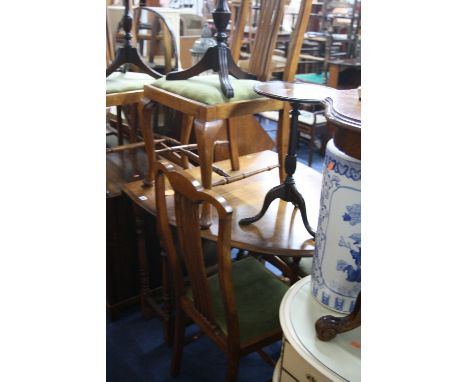 AN OAK GATE LEG TABLE, and four dining chairs with green upholstered drop in seat pads (5)