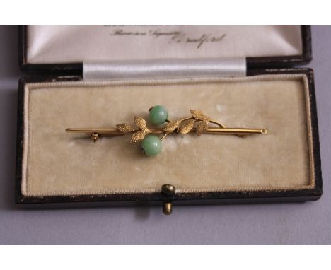 A MID 20TH CENTURY JADE BAR BROOCH, textured foliate design, measuring approximately 58mm in length, stamped 9ct, base metal 