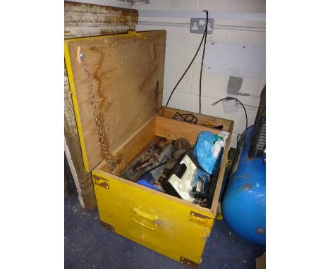 A PAINTED TOOL CRATE, containing a quantity of hand tools, including saws, chisels, planers, etc