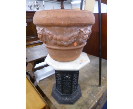 A CAST IRON CONSERVATORY STAND/PEDESTAL, and a terracotta planter (2)