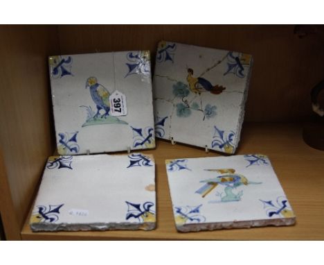 FOUR CERAMIC TILES, Delft style, with three depicting birds, largest approximately 15cm square (one cracked) (4)