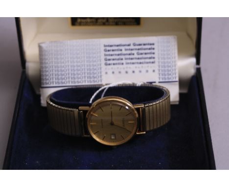 A LATE 20TH CENTURY GENTS 9CT GOLD TISSOT WRISTWATCH, a round plain polished case measuring approximately 32mm in diameter, q