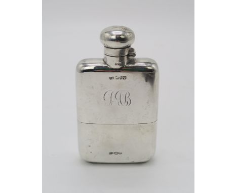 A GEORGE V SILVER HIP FLASK by Cohen &amp; Charles, Chester 1920, with a hinged bayonet cap and a removable silver cup, 12.5c