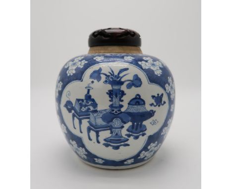 A CHINESE BLUE AND WHITE GINGER JAR the vignettes filled with One Hundred Antiques, over a cracked ice prunus pattern ground,