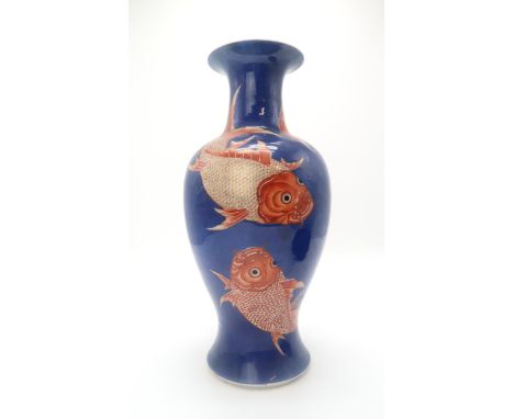 A CHINESE BALUSTER VASE Painted with coral red and gilt carp on a blue ground, blue encircled mark, 43cm high Condition Repor