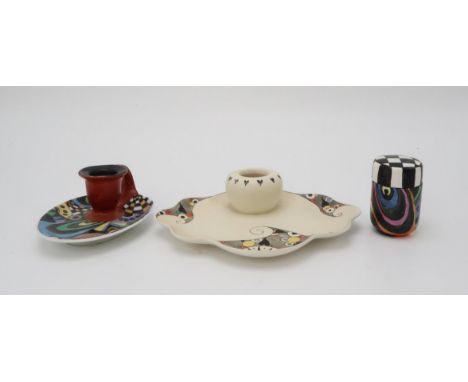 ELIZABETH MARY WATT (SCOTTISH 1886-1954) A geometric hand painted chamberstick, a geometric and checkerboard painted pot and 