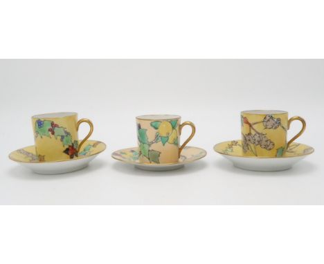 ELIZABETH MARY WATT (SCOTTISH 1886-1954) A pair of coffee cans and saucers, painted with honesty, rose hips and fruits, both 