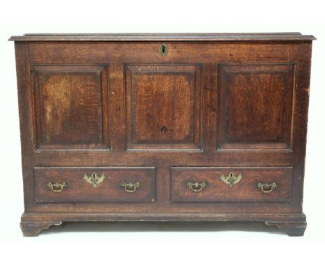AN 18TH CENTURY OAK BLANKET CHEST&nbsp; with stepped hinged top containing candle box and three short internal drawers, panel
