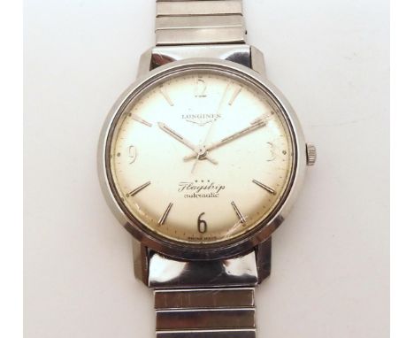 A LONGINES FLAGSHIP AUTOMATIC with silvered dial with silver coloured baton and Arabic quarters numerals and hands. Enamelled