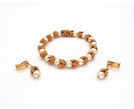 A VINTAGE BRACELET AND EARRING SET the bright yellow metal pod forms, hold a 7mm pearl in the bracelet, and a 6.5mm pearl in 