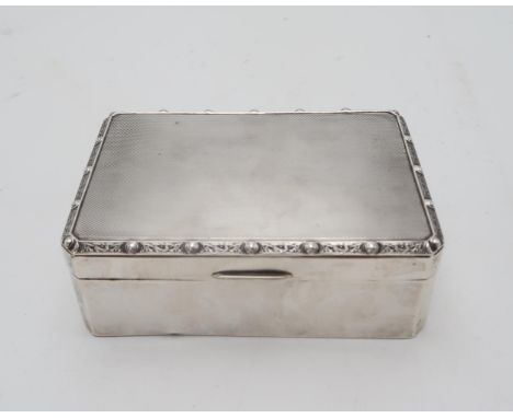 HAMILTON &amp; INCHES; A George VI silver cigarette box, Edinburgh 1936, of canted rectangular form, lined with celtic knotwo