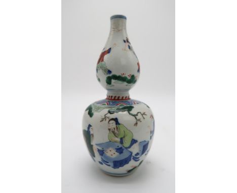 A CHINESE WUCAI DOUBLE GOURD VASE the body decorated with two scholars playing a game of Go, the neck decorated with boys pla