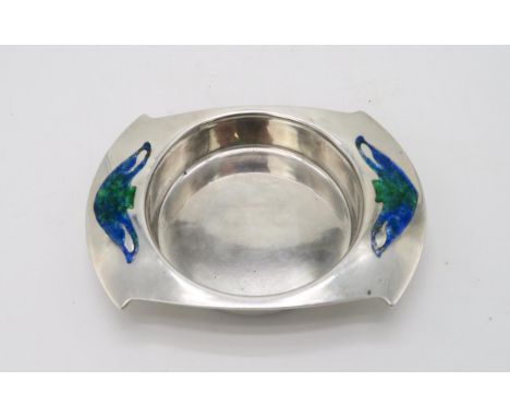 ARCHIBALD KNOX FOR LIBERTY & CO; A Cymric silver butter dish, Birmingham 1905, of stylised form, inset with enamel decoration