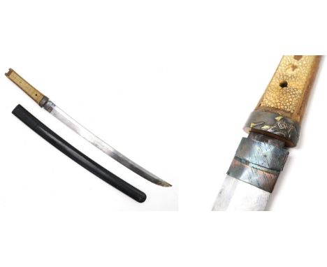 A JAPANESE WAKIZASHI SWORD The fuchi well modelled with a depiction of a Samurai, the grip of pale panelled ray skin, the tan
