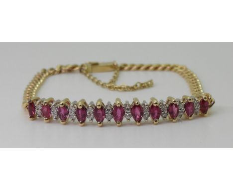 A RUBY AND DIAMOND BRACELET the gem set panel has marquis cut rubies of approx 5mm x 2.5mm and eight cut diamond accents, wit