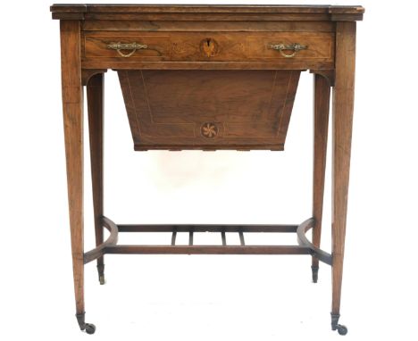 A VICTORIAN ROSEWOOD FOLD-OVER&nbsp;SEWING/GAMES&nbsp;TABLE&nbsp; with inlaid rectangular top with shaped corners which unfol