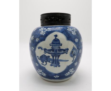 A CHINESE BLUE AND WHITE GINGER JAR the vignettes filled with One Hundred Antiques, over a cracked ice prunus pattern ground,