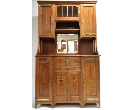 AN AUSTRIAN SECESSION STYLE OAK SIDEBOARD&nbsp; with moulded cornice over central bevelled glass door and open shelf flanked 