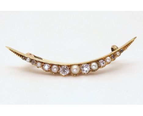 CRESCENT MOON BROOCH the bright yellow galleried mount is set with old cut diamonds and pearls, with an estimated approx diam